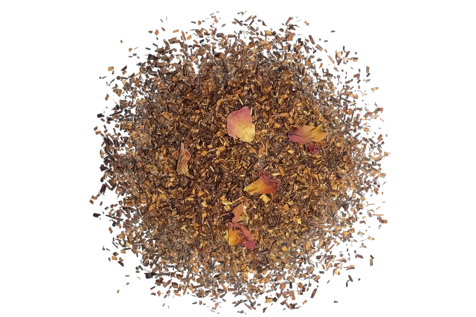A close-up of rooibos Earl Grey, and bergamot with pieces of rose petals scattered throughout.