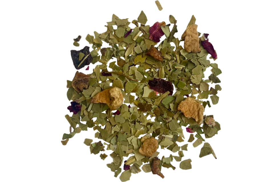 A pile of dried guava, rose petals, blackberry leaves, and yerba mate leaves, which are the ingredients of Guava Maté Wellness Tea.