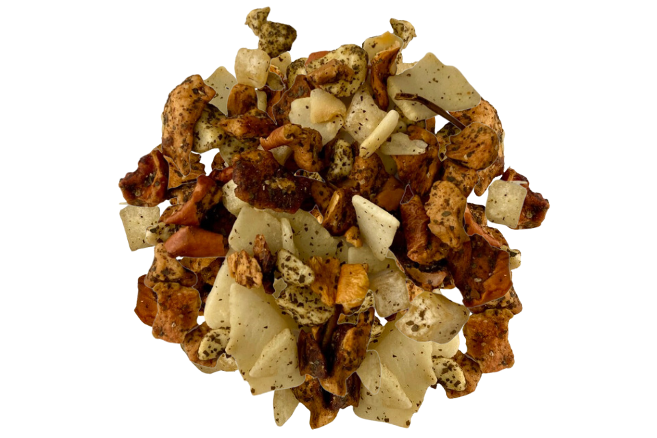 A close-up image of a Tisane tea blend, showing a mix of roasted coconut flakes, freeze-dried marzipan almond drops, apple pieces, pineapple cubes, and other ingredients.
