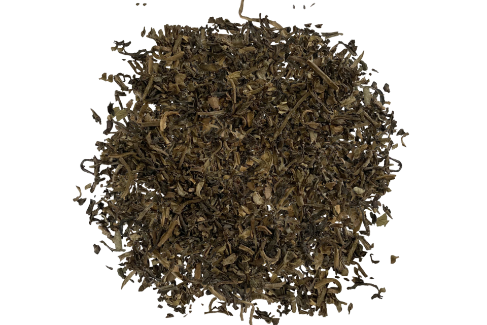 Dry tea leaves on a white background