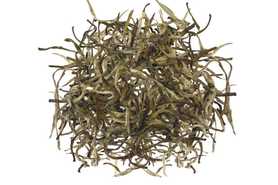 A pile of dried, withered leaves of Darjeeling premium India white tea.