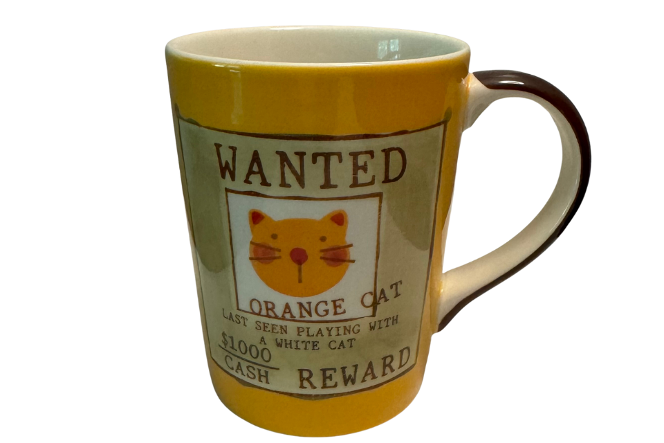 Mug with a 'Wanted' poster design featuring an orange cat on a white background