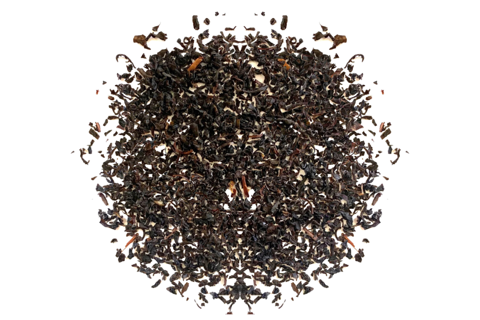 A close-up image of a pile of loose Ceylon premium black tea leaves.
