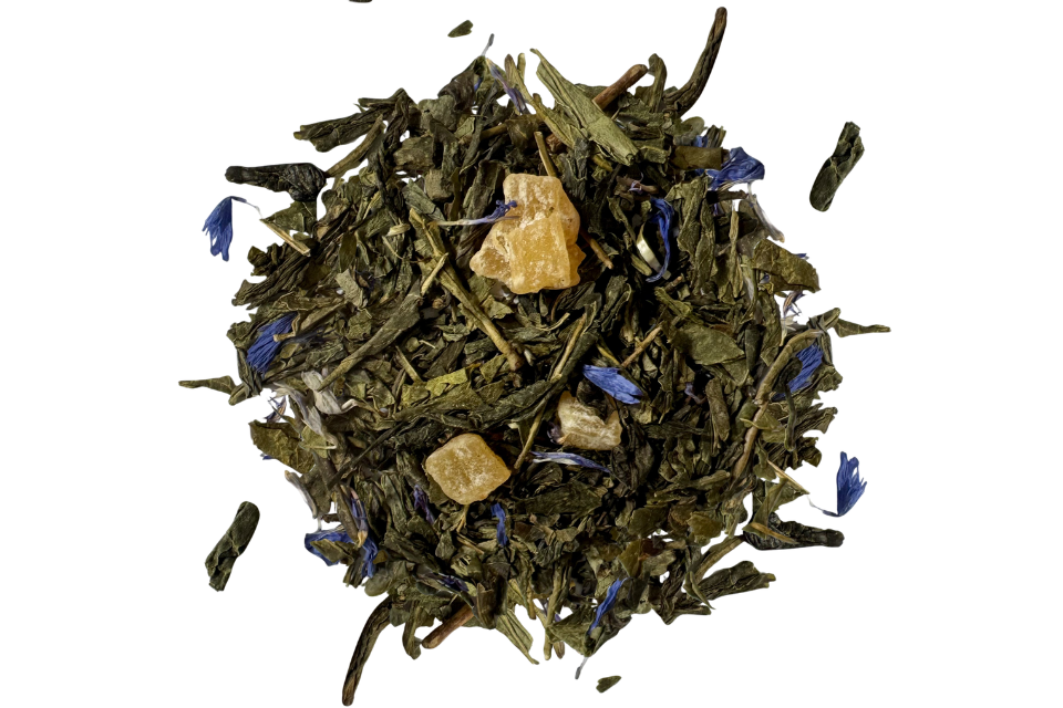 Green tea leaves with papaya pieces and blue flower petals.