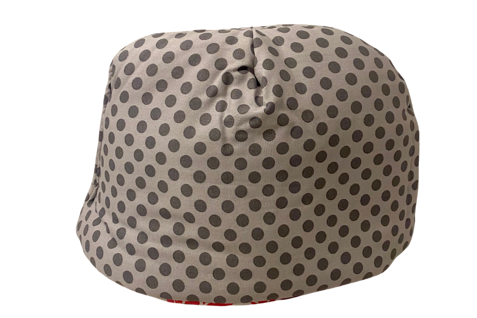 a polka dot printed tea cozy