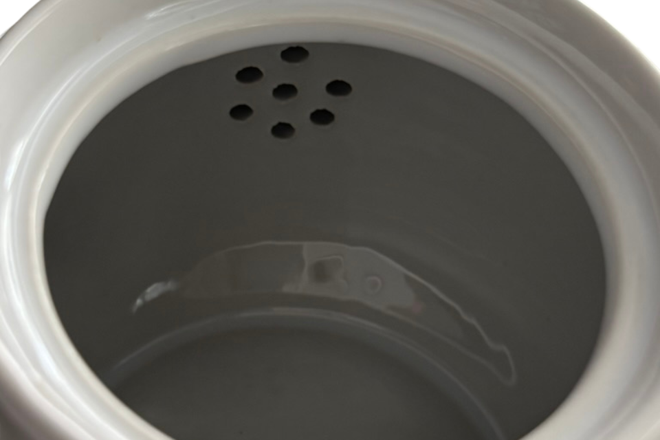 White teapot. The Tea Time Shop