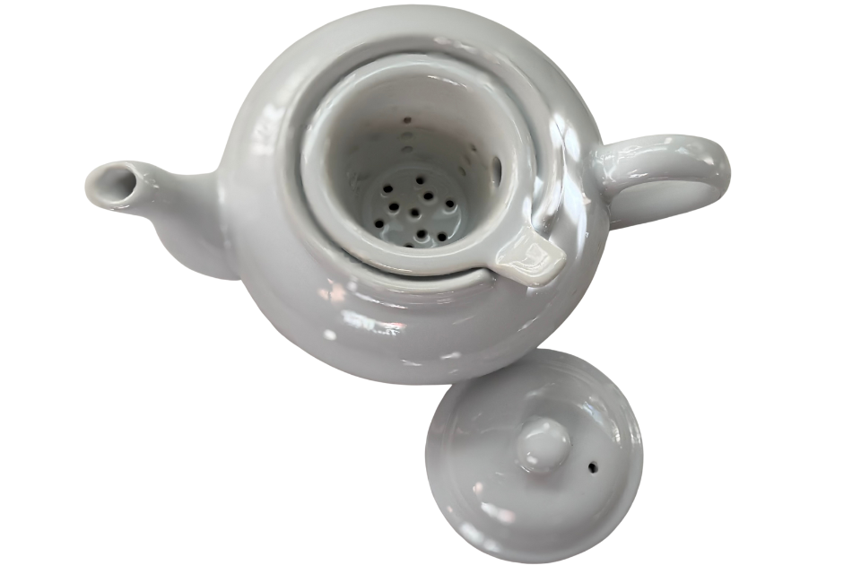 White teapot. The Tea Time Shop