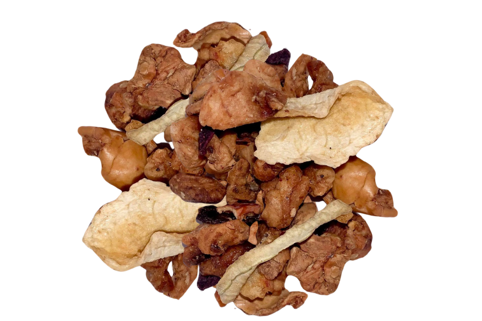 Dried fruit pieces including what appears to be watermelon, apple, and possibly beetroot, used for making the Sandía Watermelon Tisane Tea.