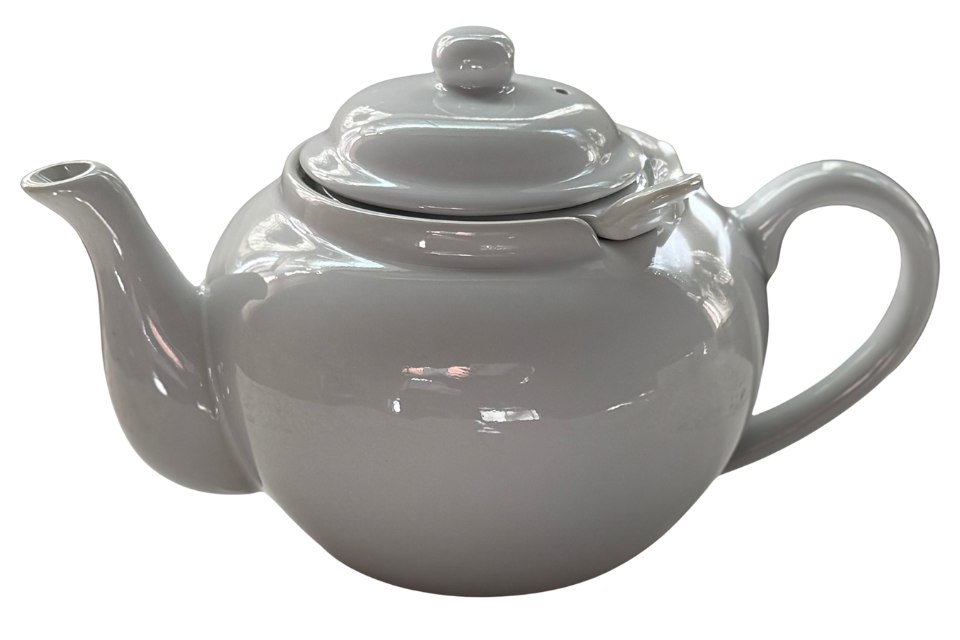 White teapot on a white background. The Tea Time Shop