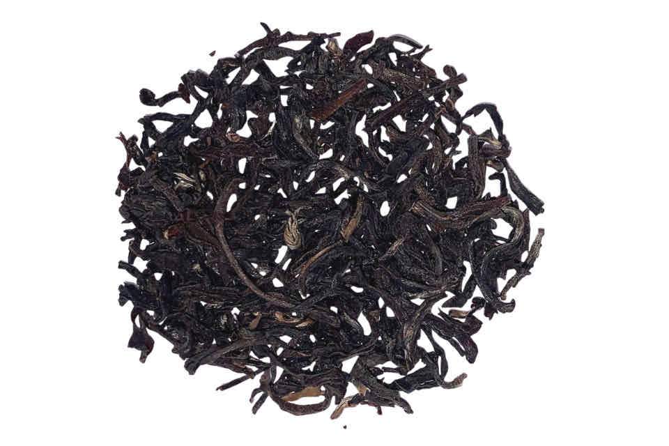 A pile of dry black tea leaves