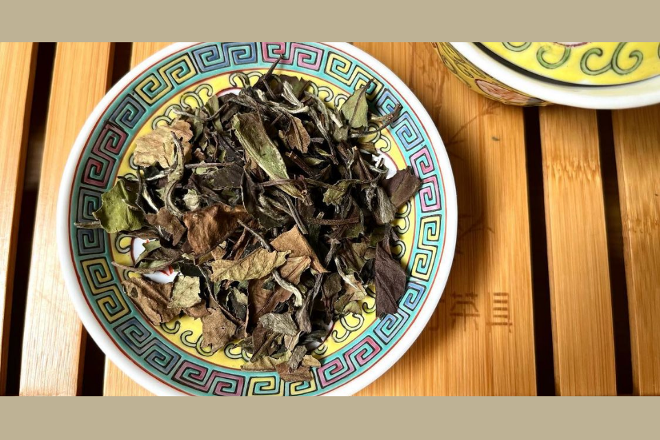 a pile of bai mu dan white tea on a plate 