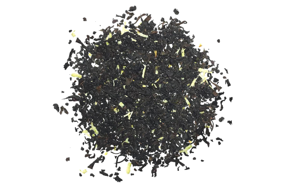 A close-up image of loose leaf black tea with pieces of coconut and vanilla bean bits incorporated throughout.