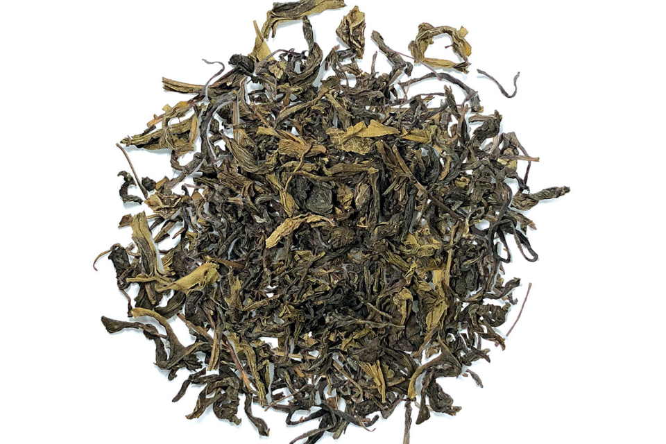 A heap of dried Darjeeling Supreme Green Tea leaves.