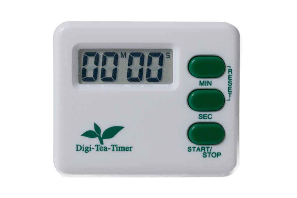 A white digital tea timer with a green start and stop button, and a display screen showing '00.00'.