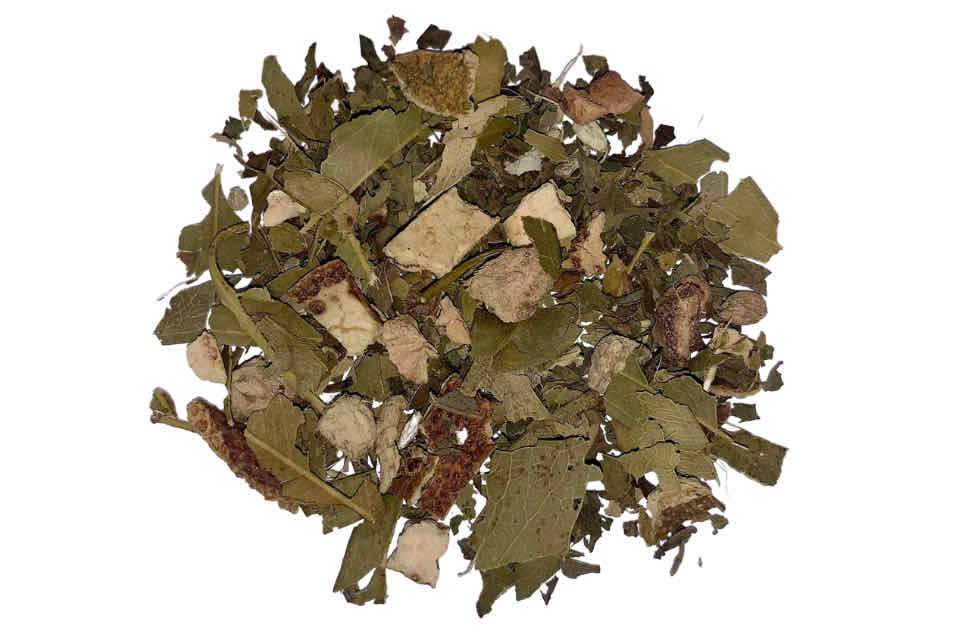 A close-up image of dried eucalyptus leaves and pieces of ginger root, which are ingredients in Eucalyptus Wellness Tea.