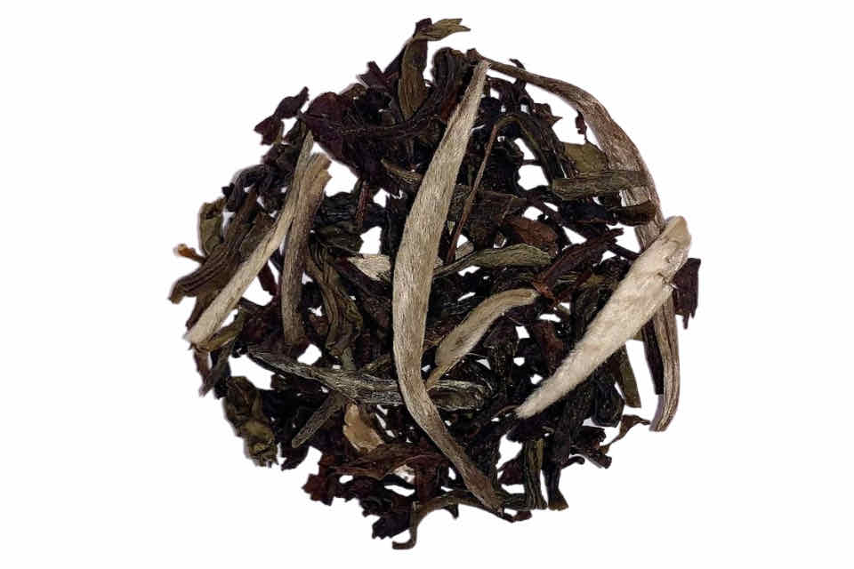 A ball of smoked tea leaves resembling genghis khan smoky tea