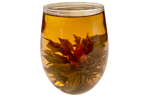 guava blooming tea ball in a glass cup with an amaranth flower bloomed inside