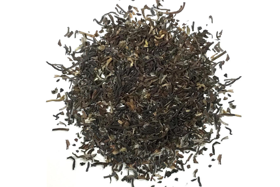 A heap of dark brown Darjeeling 2nd flush tea leaves.