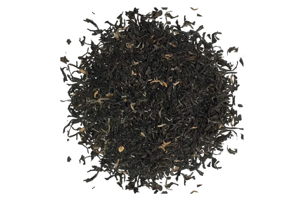 A heap of loose Assam black tea leaves after steeping.