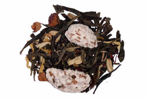 A pile of dried apple ginger green tea ingredients including green tea leaves, dried apple slices, ginger pieces, almonds, marigold flowers, and safflowers.