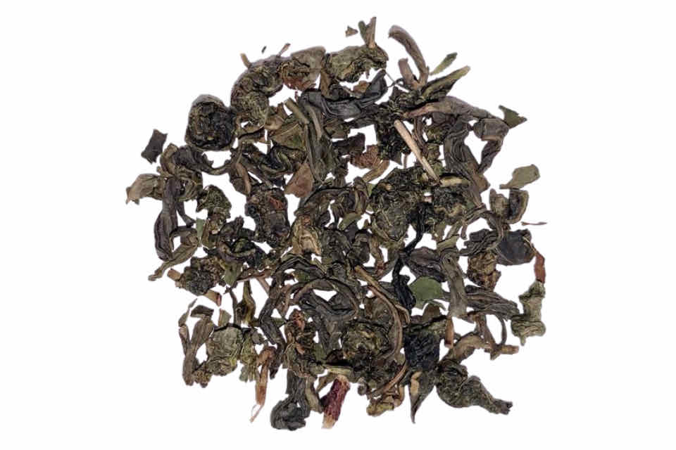 a pile of green jasmine tea and oolong tea