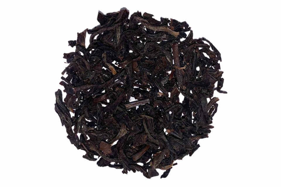 A heap of smoked lapsang souchong black tea leaves.