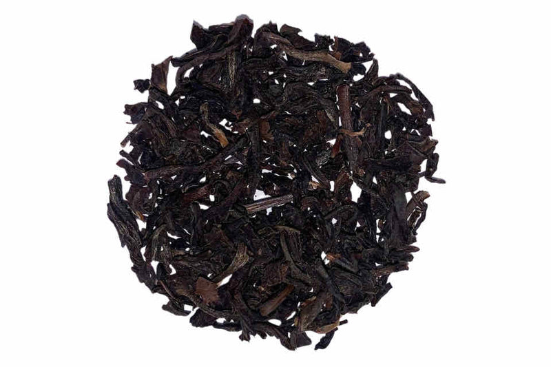 A heap of smoked lapsang souchong black tea leaves.