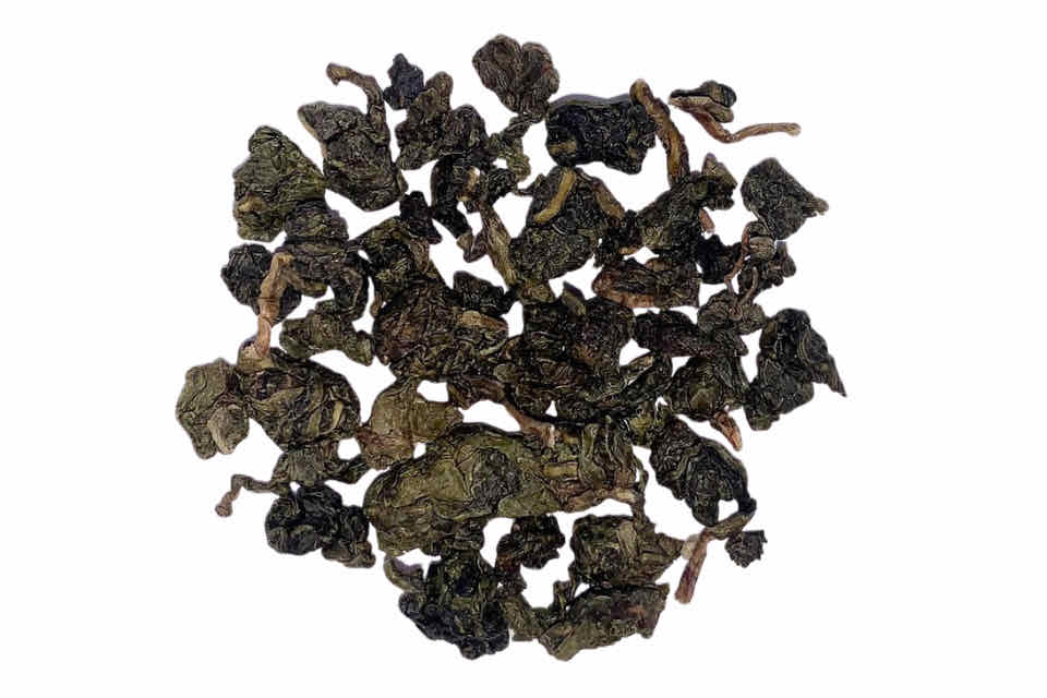 A pile of dark, crinkly oolong tea leaves.