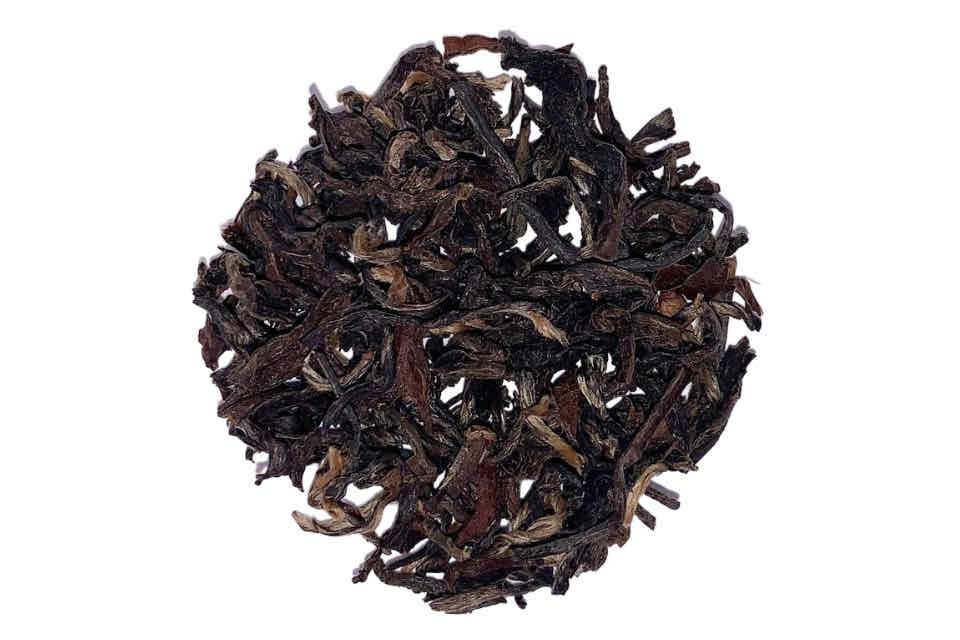 A pile of loose black tea leaves.