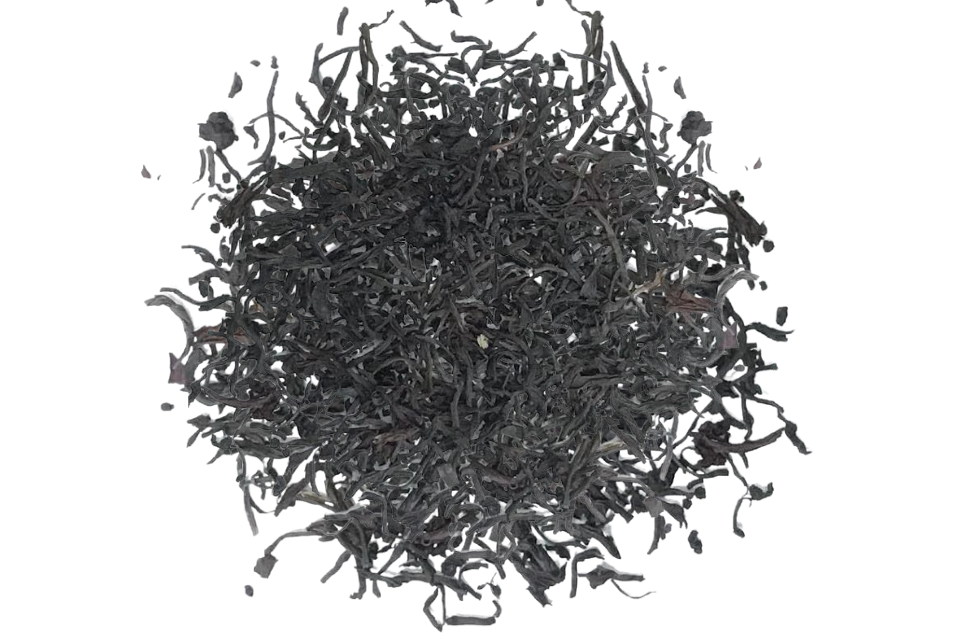 A close-up image of loose leaf black tea, indicating a product ready for steeping to create a beverage.