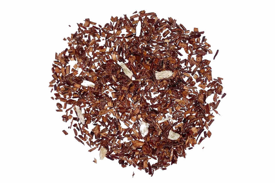 A pile of premium rooibos tea with coconut shreds. The Tea Time Shop
