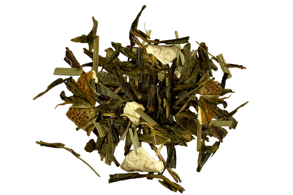 A close up of dried tea leaves and pieces of fruit, including what appears to be lemongrass and orange peel, indicative of the ingredients in Green Mandarin Premium Tea.