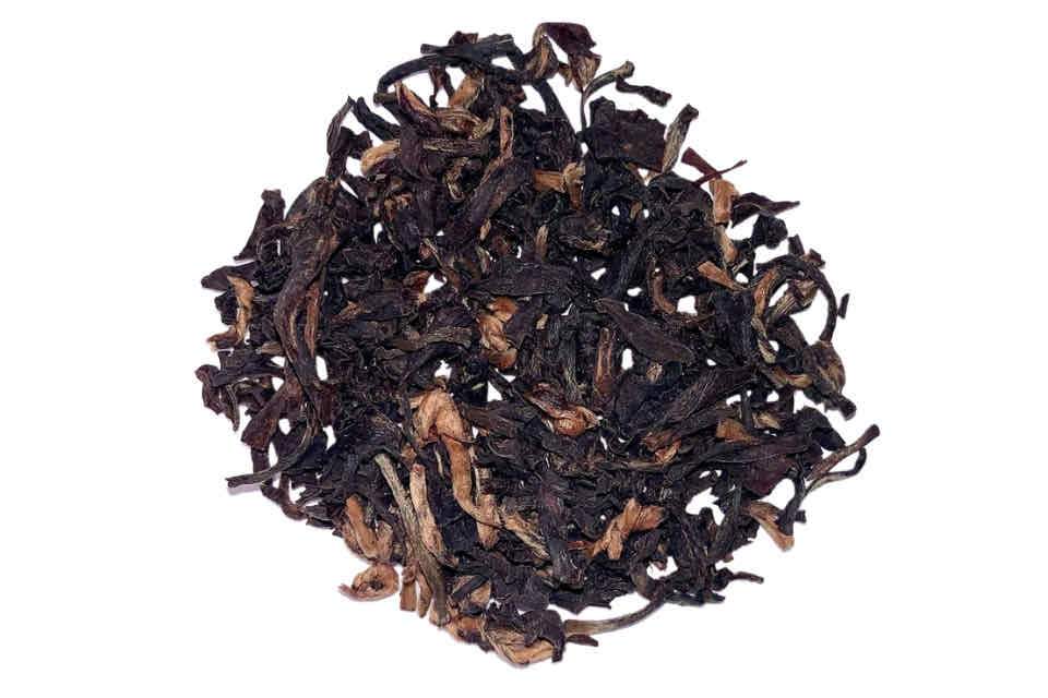 A heap of dried Assam black tea leaves.