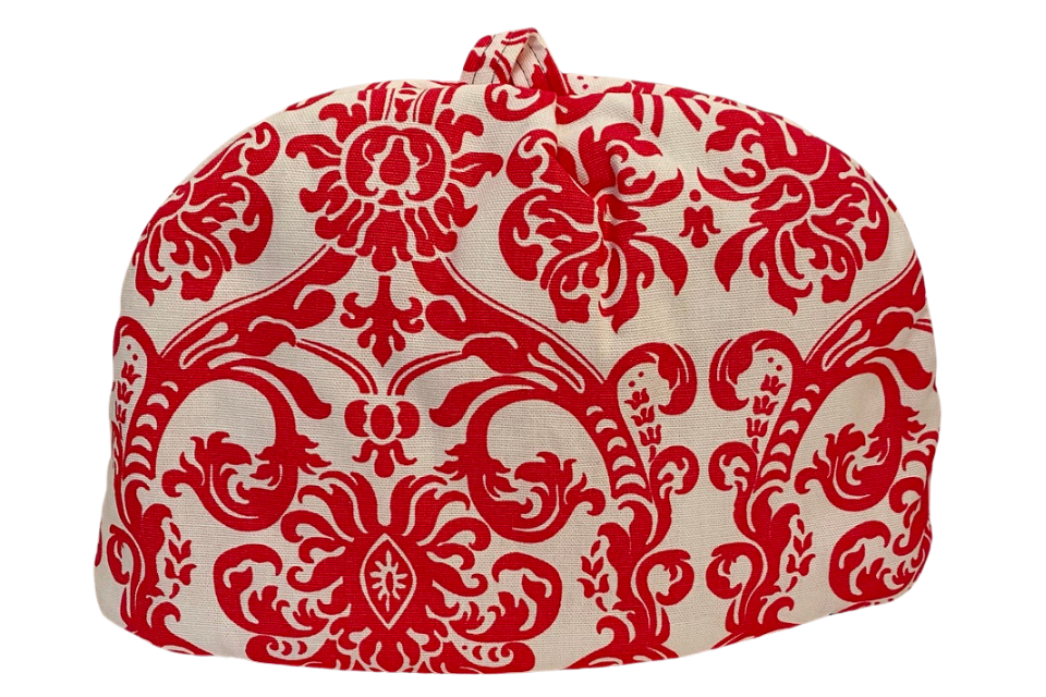 a tea cozy with a pink paisley patten 