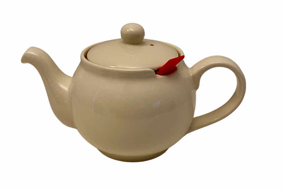 A picture of a cream colored chatsford teapot with an infuser basket.