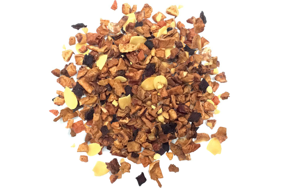 A pile of toasted almond tisane tea with visible pieces of almonds, apple, and beetroot.