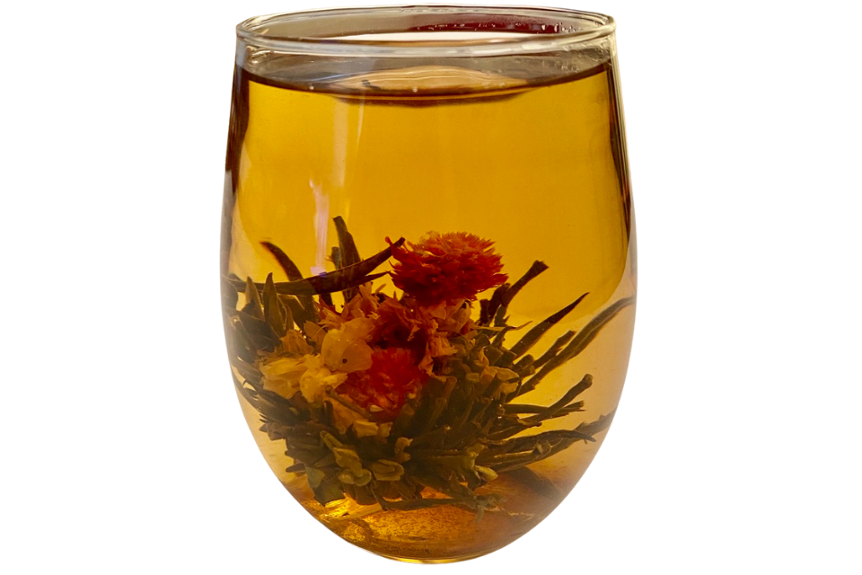hand-tied green twin jasmine blooming tea in a glass