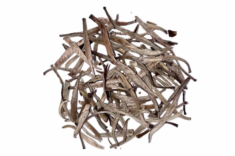 A heap of dried silver jasmine tea leaves.