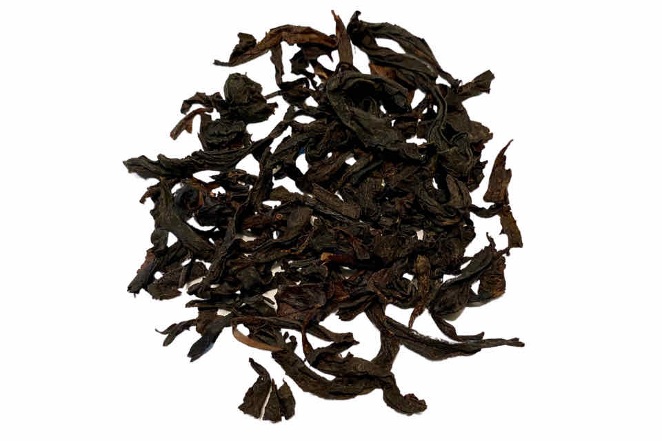 a pile of dried wuyi oolong tea leaves